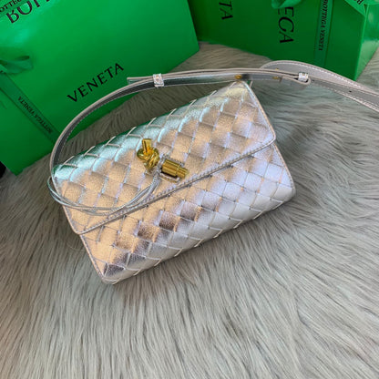 Andiamo Clutch in Metallic Intrecciato Leather Bag