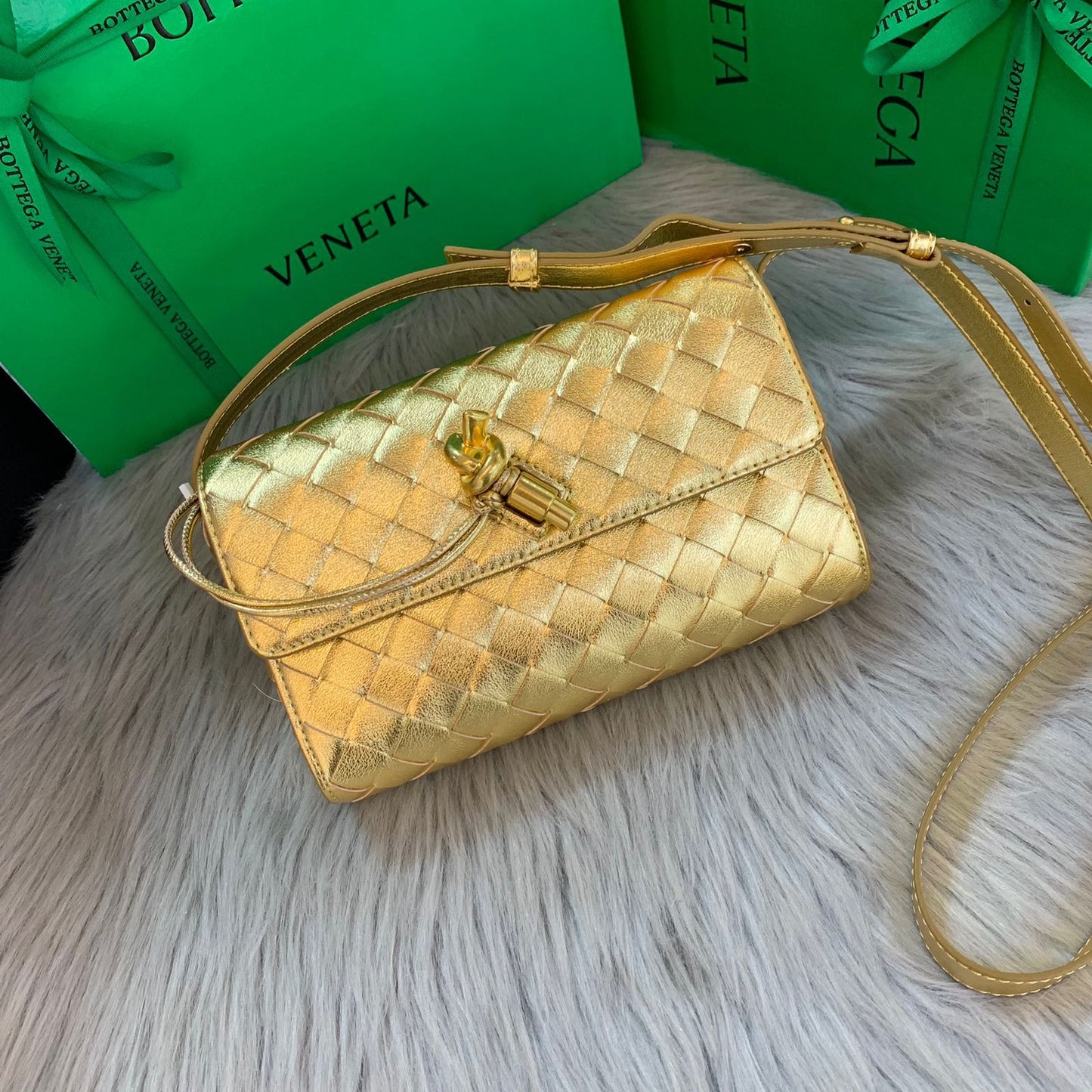 Andiamo Clutch in Metallic Intrecciato Leather Bag